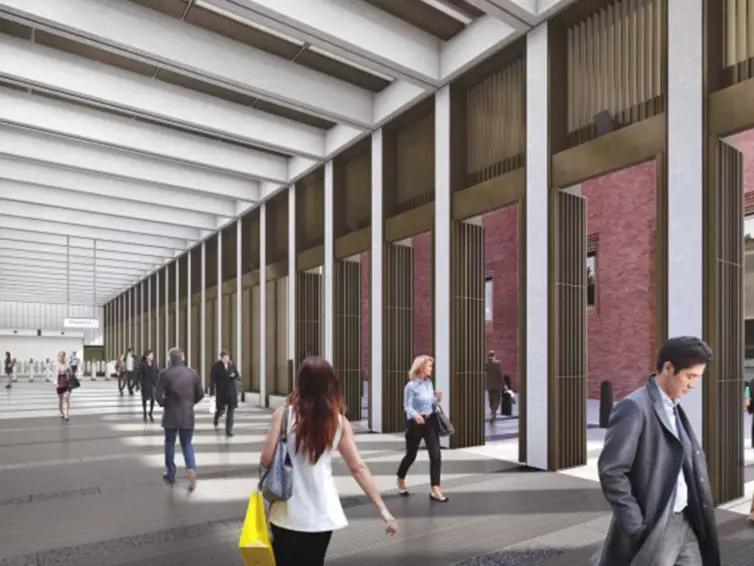 People walking through Bond Street station.