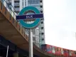 DLR sign with train in background
