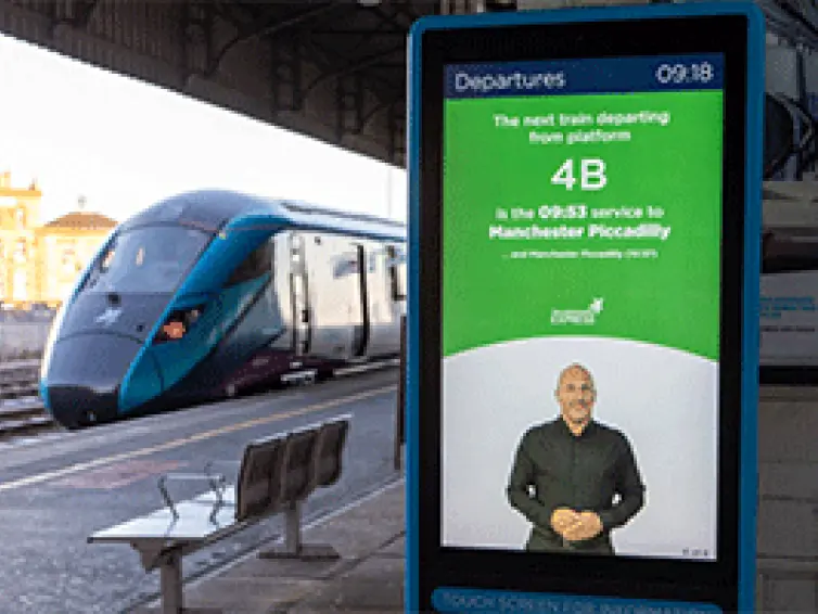 Information totem show departures announcements in sign language.