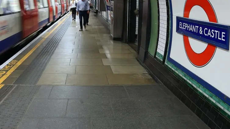 people on the platform at Elephant and Castle underground station.