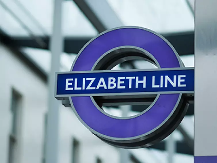 Elizabeth line underground sign outside.