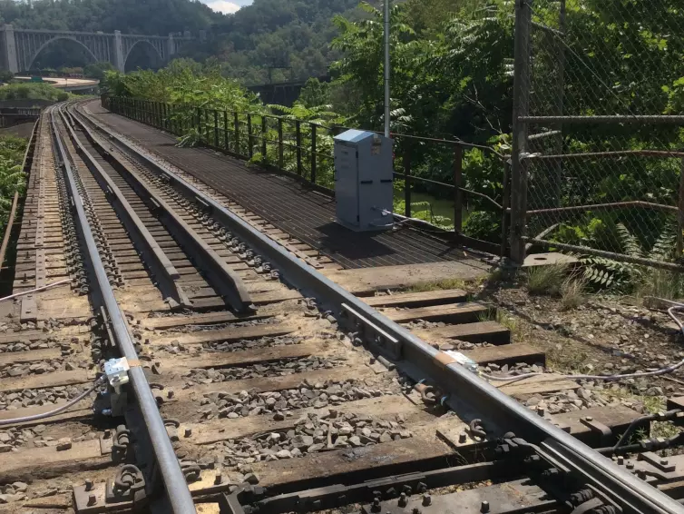 Traction Gel Applicator with solar panel at side of railway track.