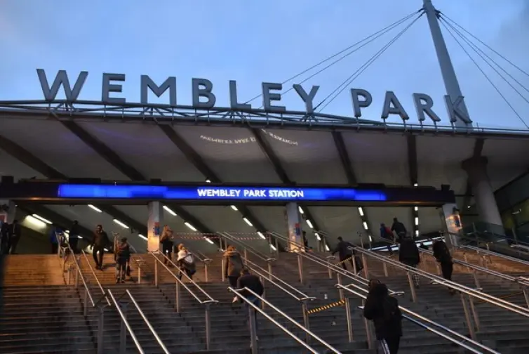 People on the steps leading up to Wembley Park Station.