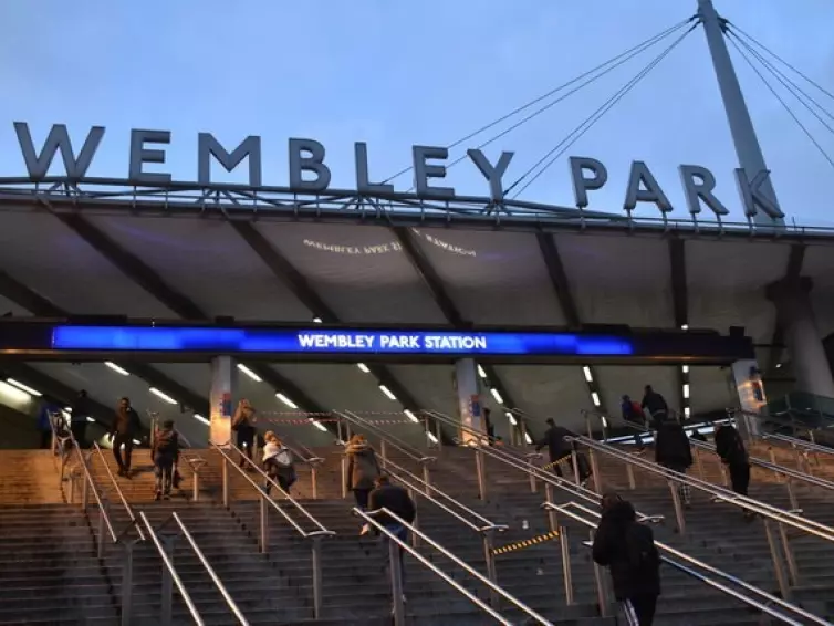 People on the steps leading up to Wembley Park Station.