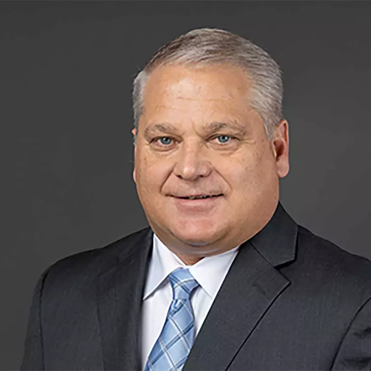 Headshot of John Kasel, man smiling.