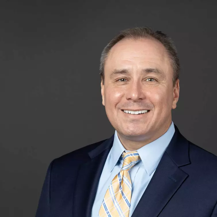 Headshot of Patrick Guinee, man smiling.