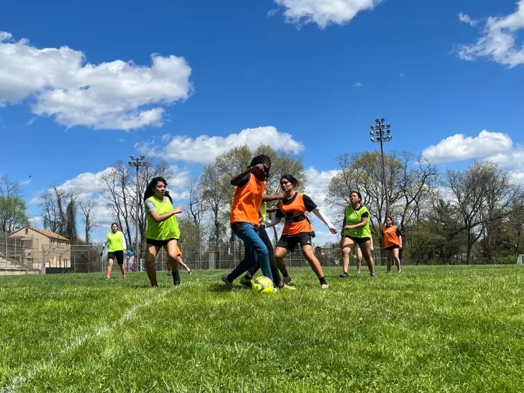 girls playing soccer.