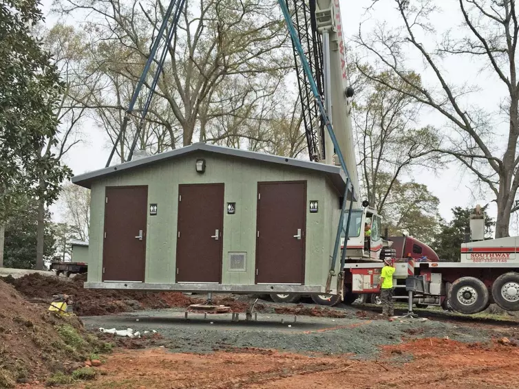 CXT flush restroom being set with crane.