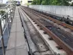 suspended train tracks shown with oncoming train