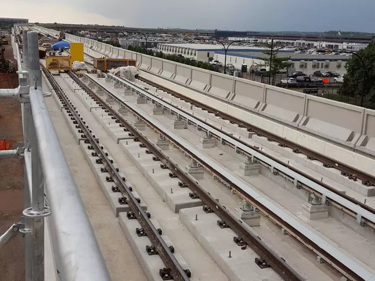 standard direct fasteners on a railroad track.