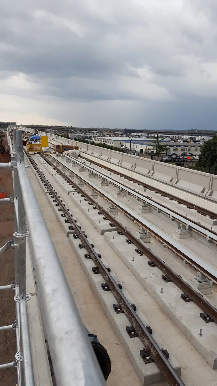 standard direct fasteners on a railroad track.