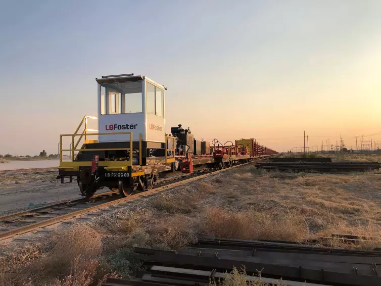 LB Foster branded train case carrying materials on a train track.