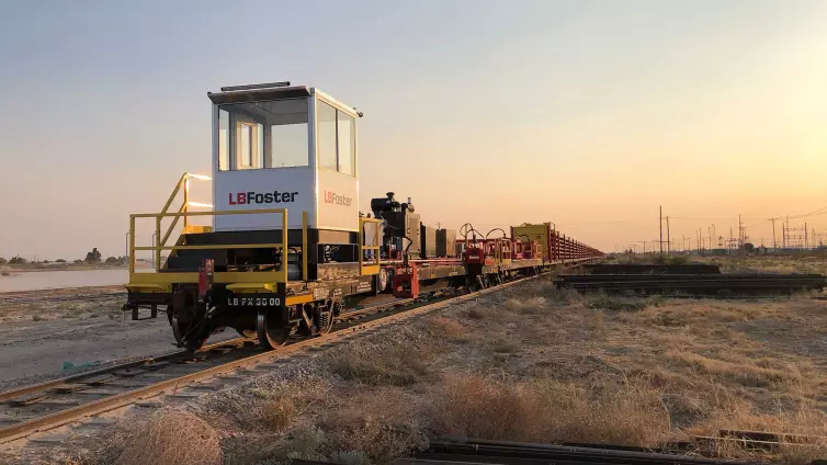 LB Foster branded train case carrying materials on a train track.