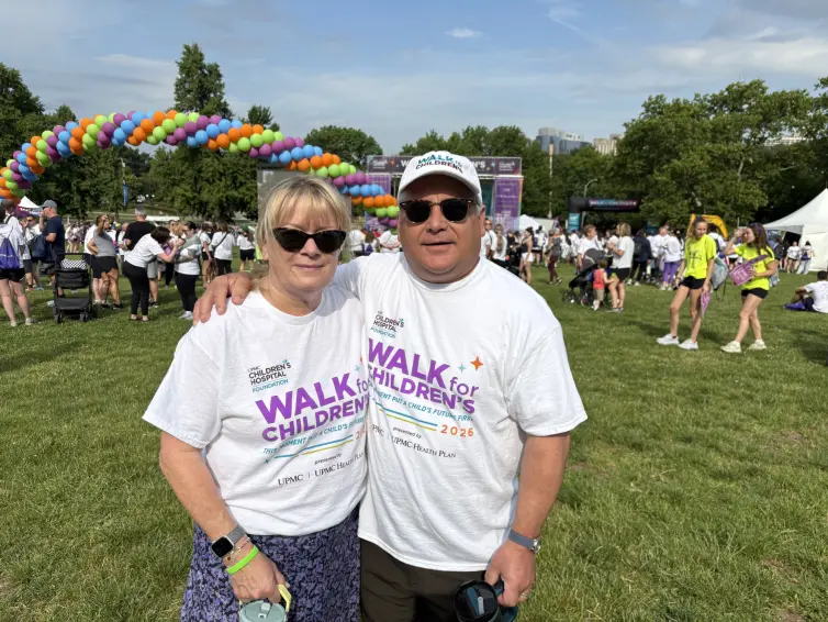 Woman and a man smiling. Katie Kasel and John Kasel, President & CEO.